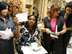 Mujeres en el Grameen American Bank en Queens show sus documentos de préstamos sin garantías.